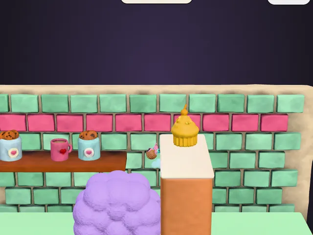 Fella climbing the clay lump towards the cupcake